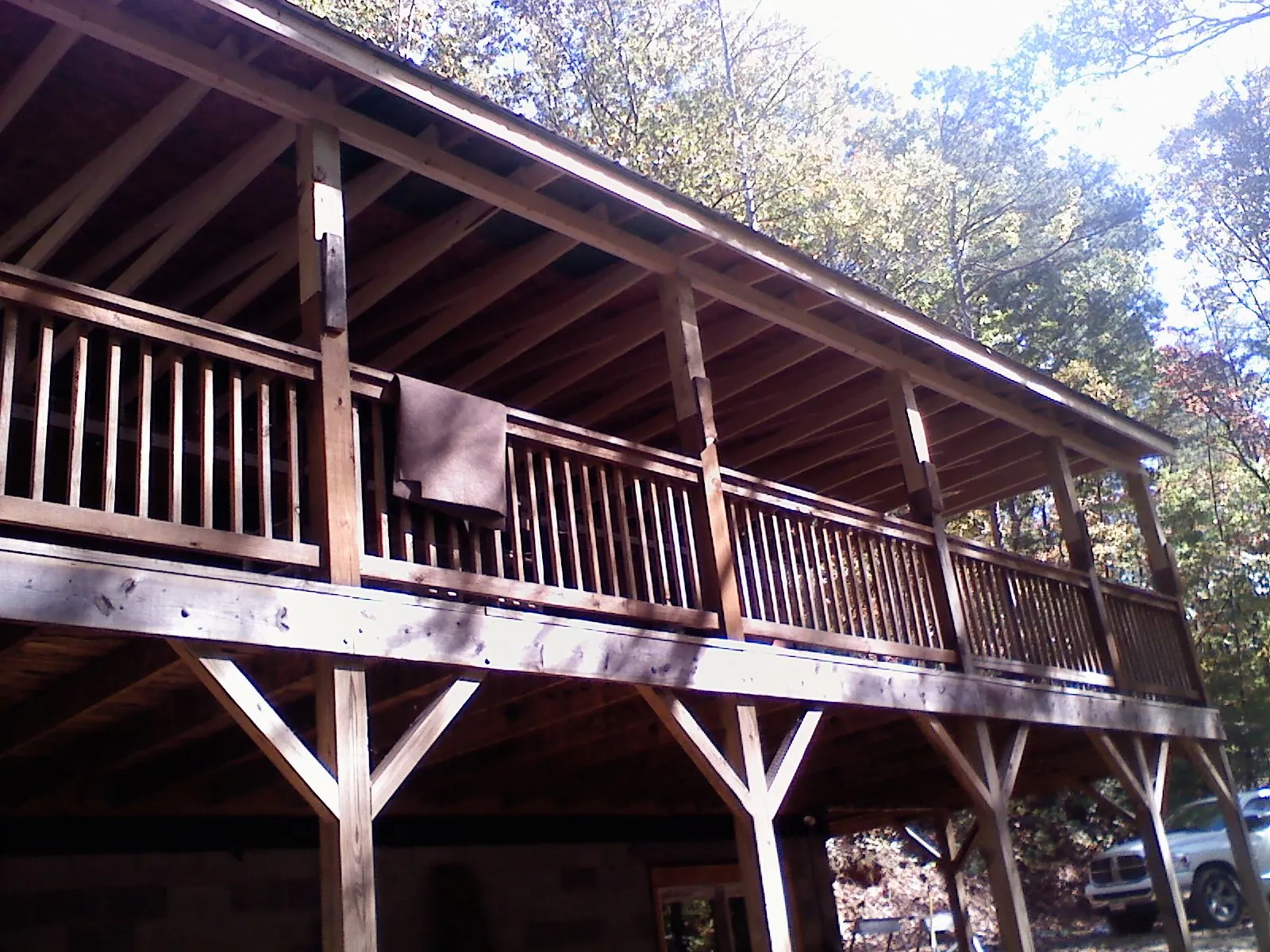 Timber framing under a new elevated porch and deck — Roof Leak Repair in Laramie by Roofing Brothers